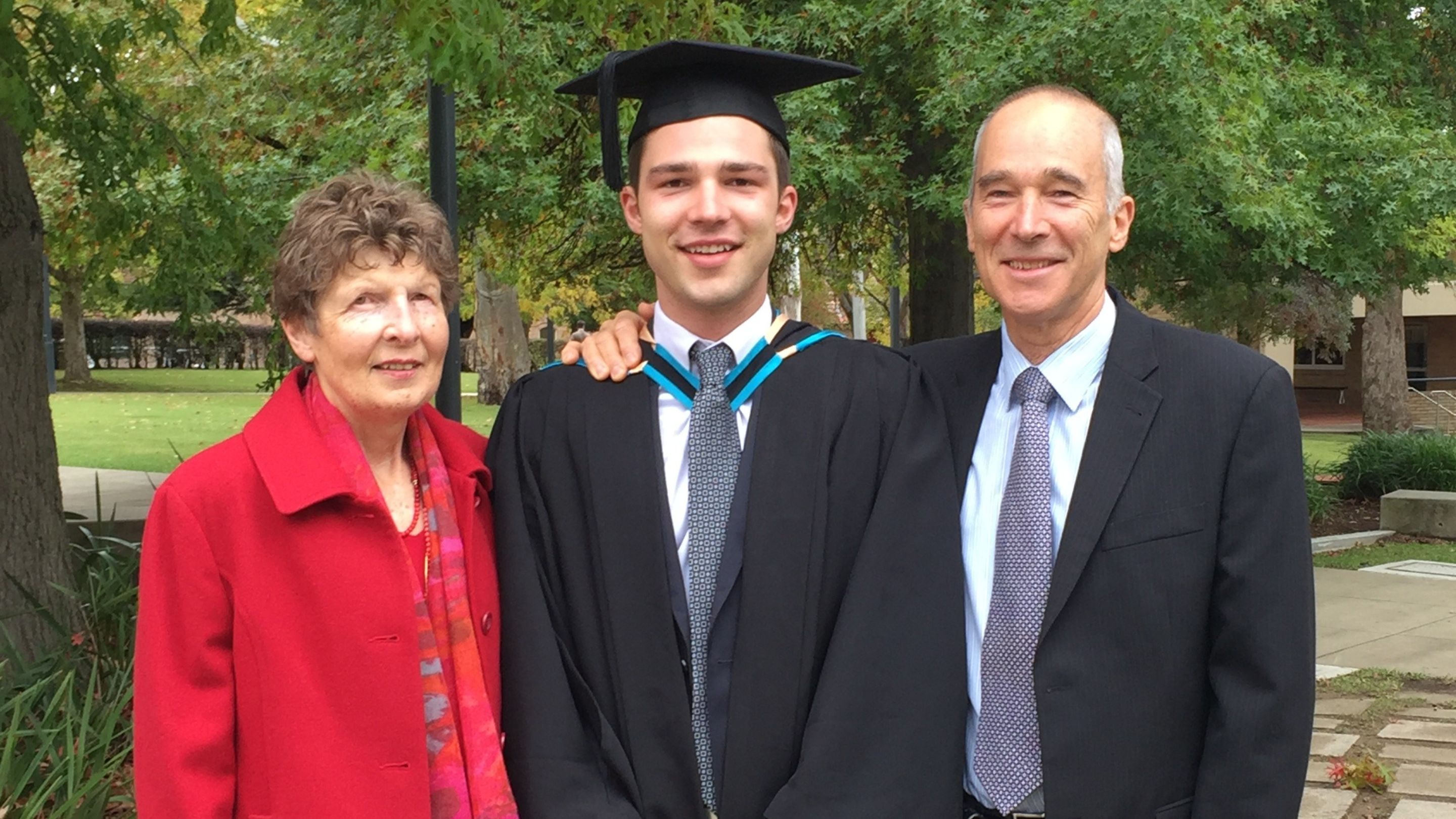 Bryce at his graduation with his parents. (Source: supplied)