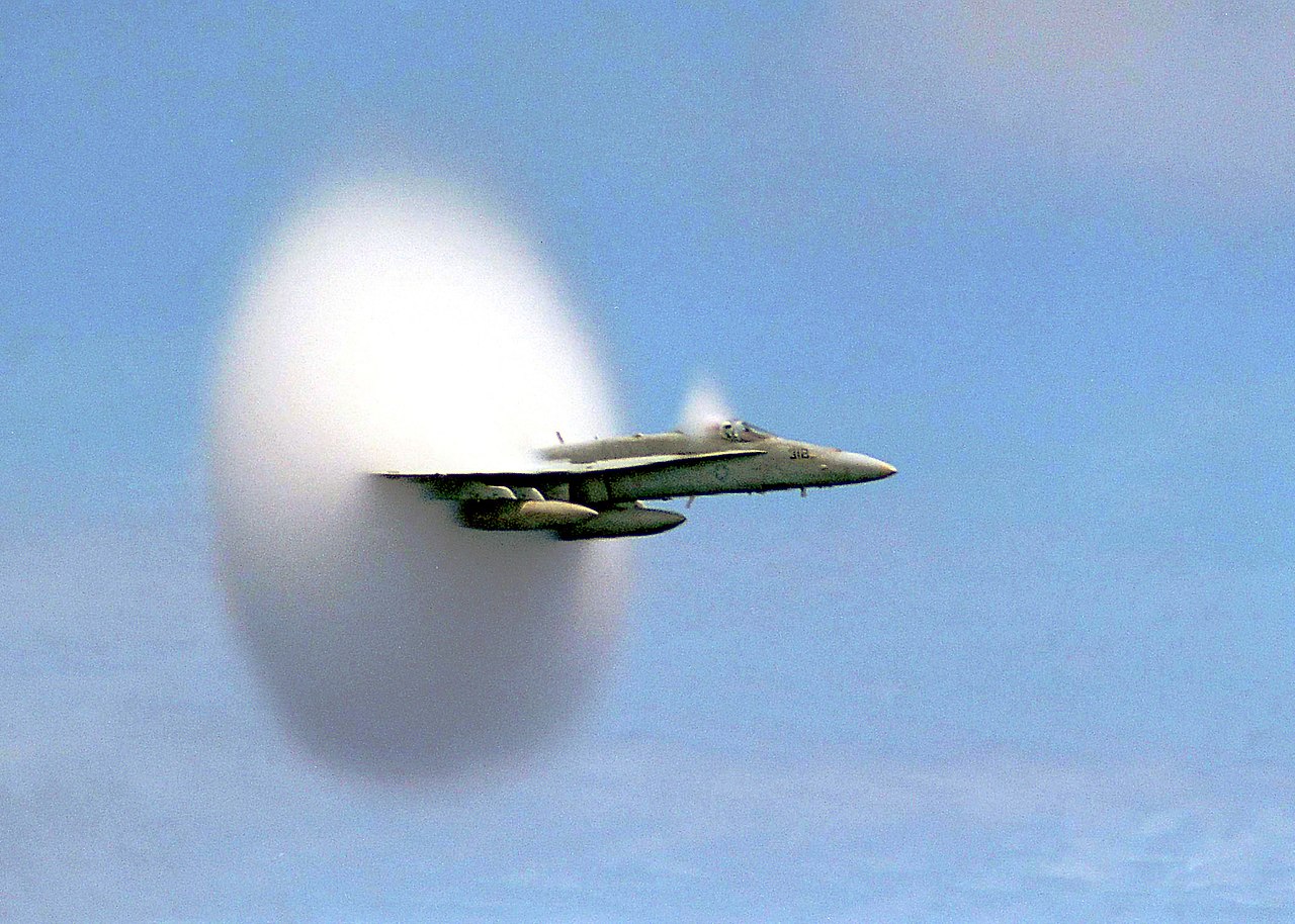Air is a fluid and offers resistance to any object moving through it (FA-18 transonic vapor cone)