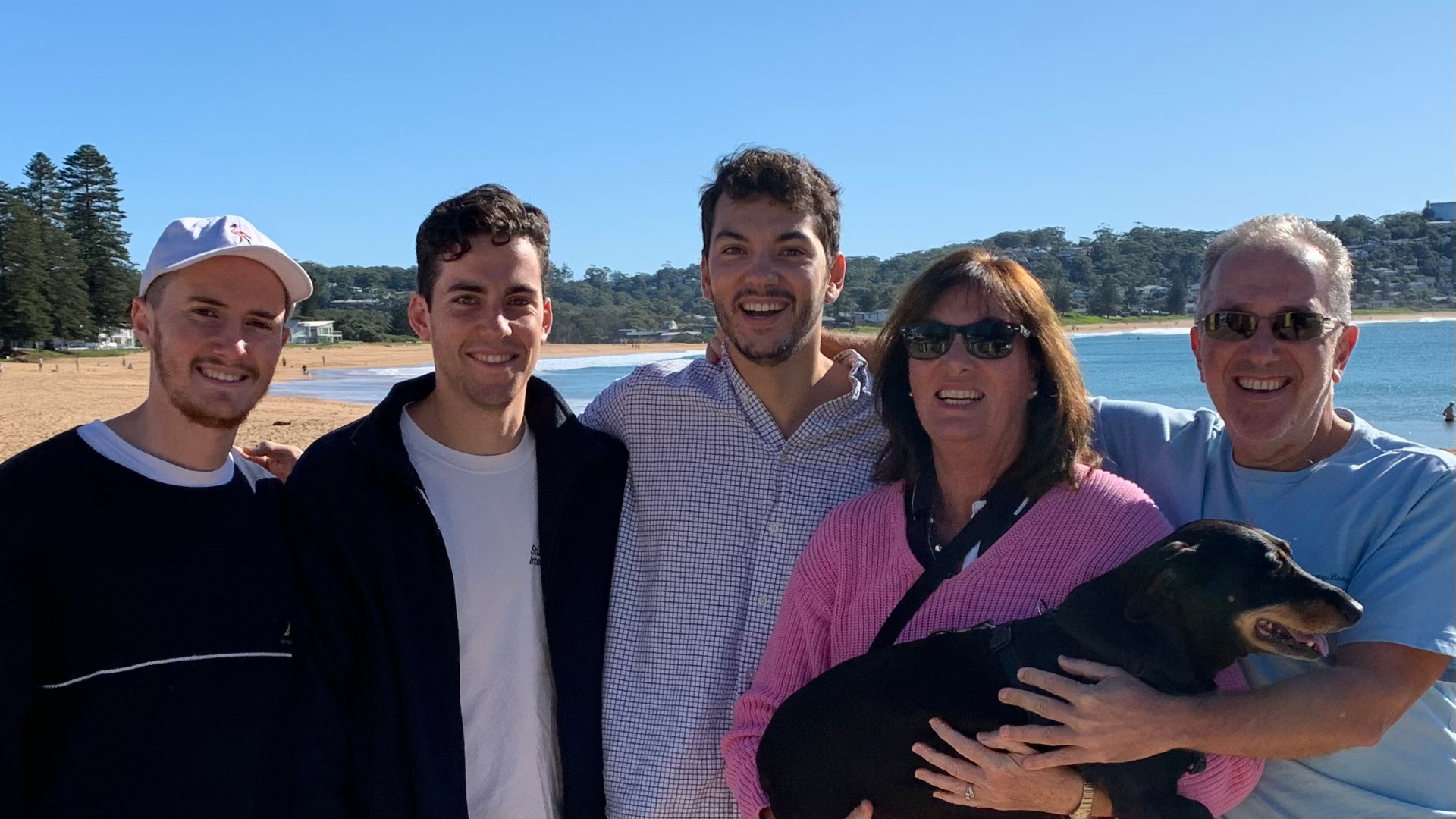 Michael and his family at Avoca Beach. From left to right: James, Michael, David, Kathryn (and the family dog Denzel) and Peter. (Source: supplied)