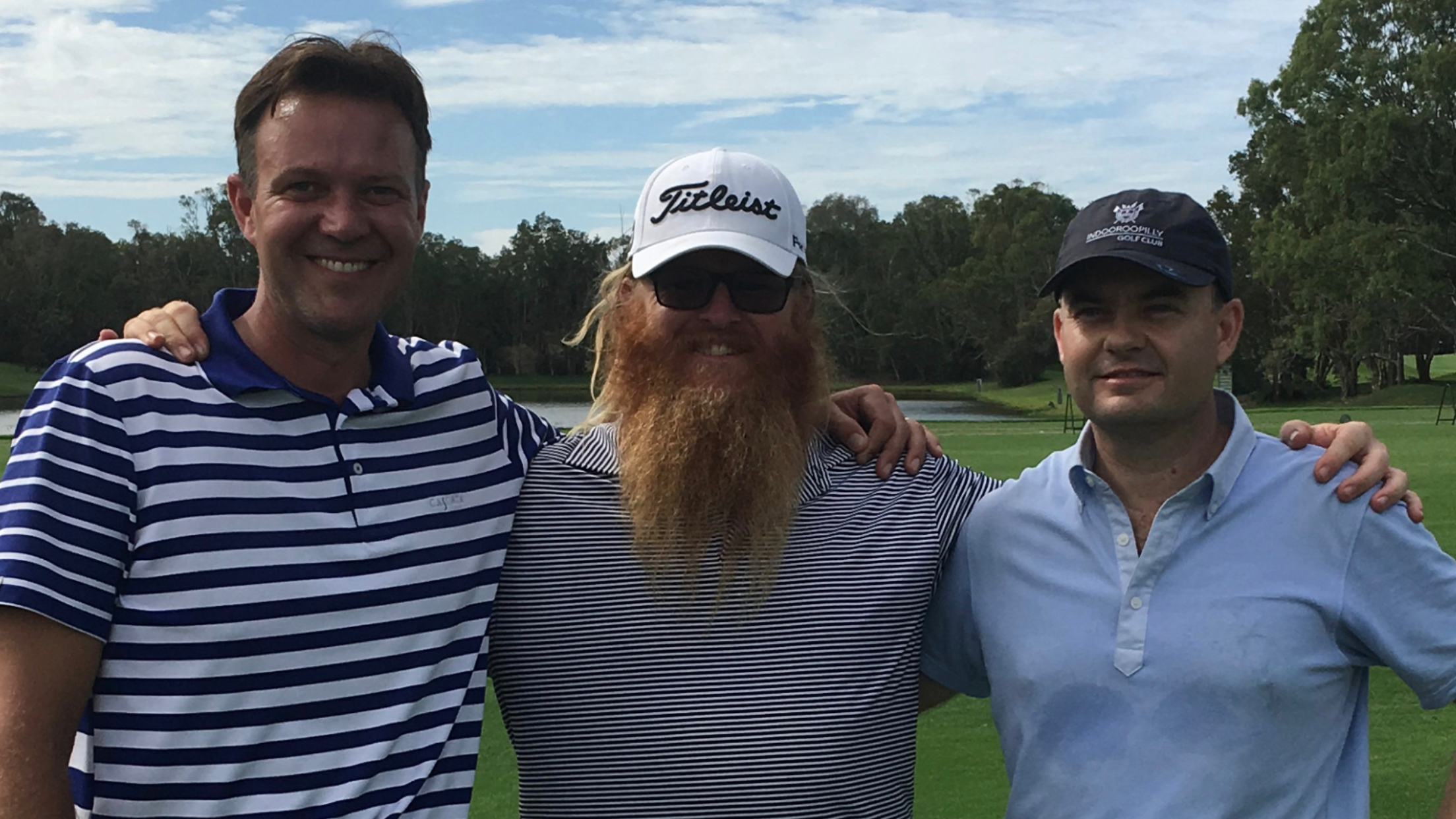Emmet (far right) with his two friends after a game of golf. (Source: supplied)